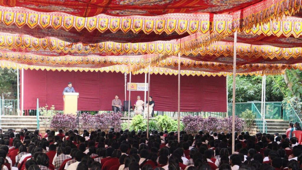 Mr. Pratap, police officer from Central Kaim Station in Hassan, addressing students of Vijaya School during an awareness camp on the perils of social media.