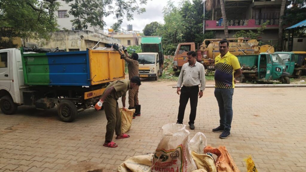 Arasikere Municipal Council staff at work on the innovative garbage segregation, disposal and cow-feeding project.
