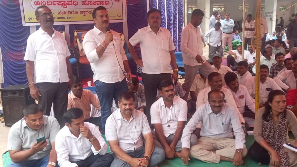 RDPR staff staging a protest in Hassan district on Tuesday.