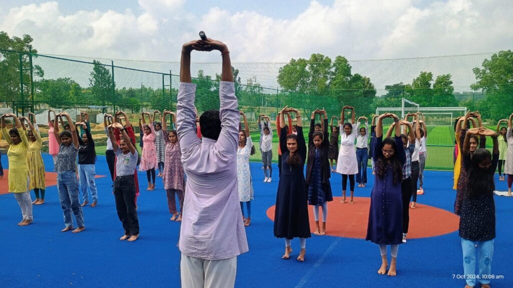 Founder of Swasthya Jeevan Marga Yoga Pratisthan of Nagamangala, Sriyutha Laxman KH Guruji, conducting a yoga programme for students of Navkis Engineering College in Hassan on Tuesday.