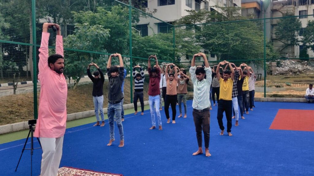 Founder of Swasthya Jeevan Marga Yoga Pratisthan of Nagamangala, Sriyutha Laxman KH Guruji, conducting a yoga programme for students of Navkis Engineering College in Hassan on Tuesday.