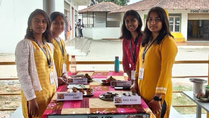 Students of Navkis Engineering College presenting foods unique to Karnataka at a food fair on the occasion.