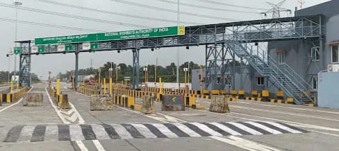 The tollgate at Chaulagere and local people protesting the 'unfair' collection.